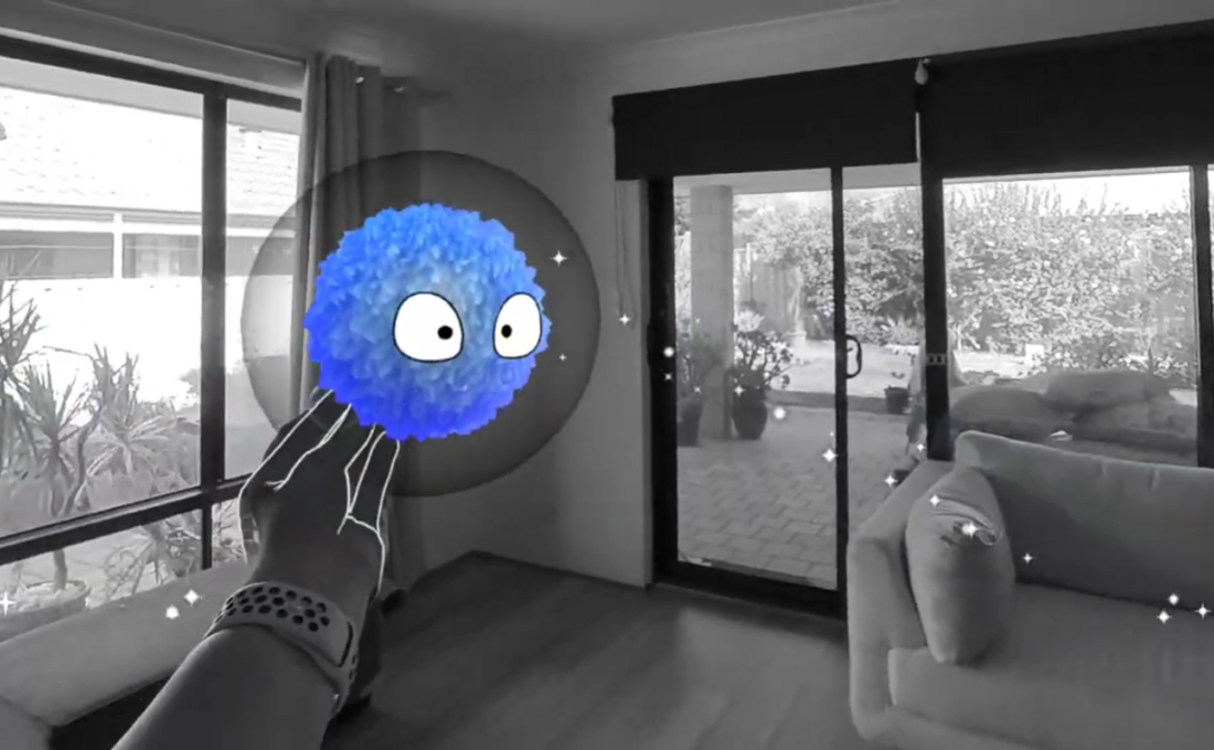 Mycelium mixed reality scene with a blue spore being touched by a tracked hand